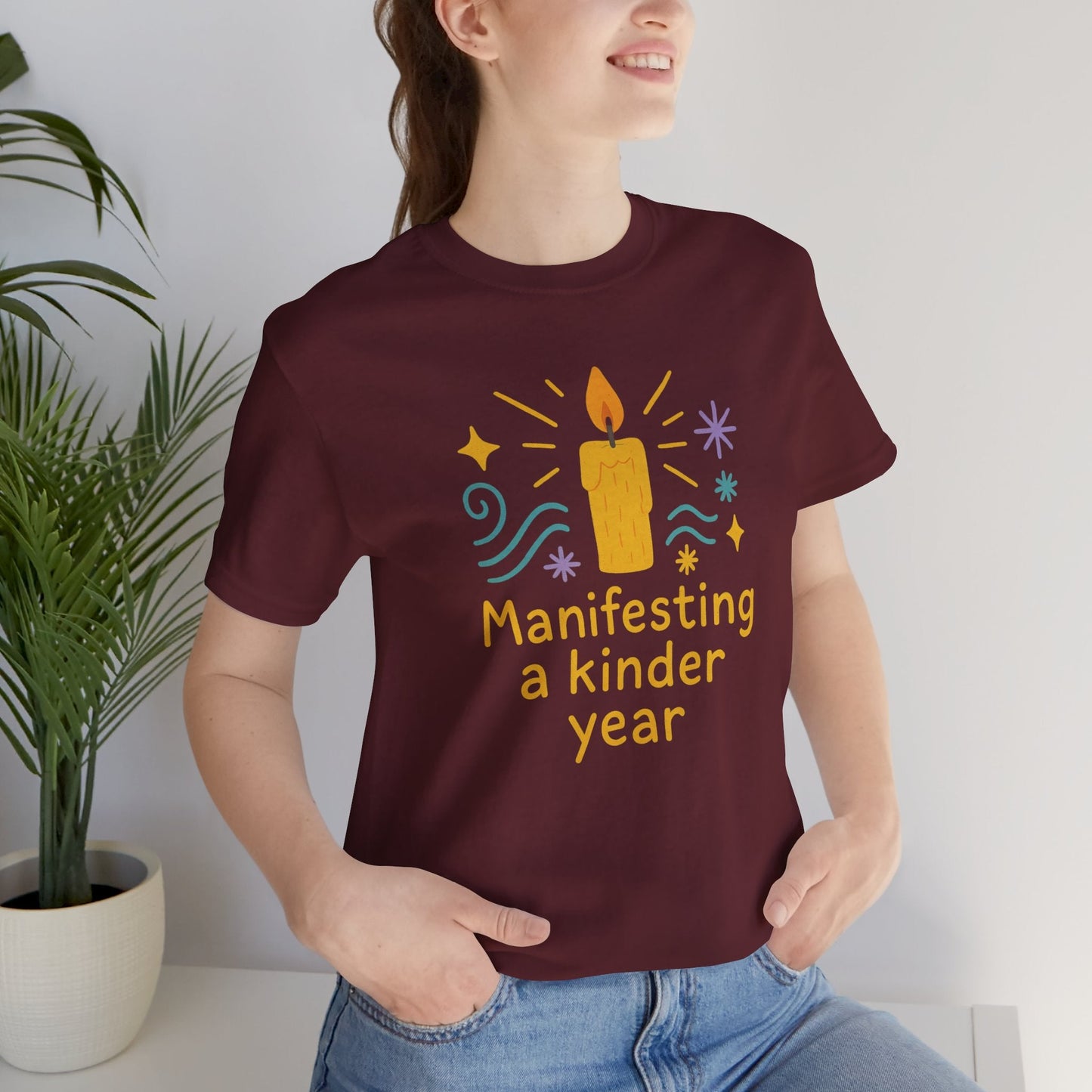 Soft spiritual graphic tee featuring "Manifesting a Kinder Year" design, perfect for mindful and positive energy.