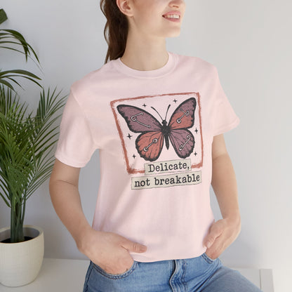 Delicate Not Breakable Butterfly Pocket Tee – Minimalist Affirmation T-Shirt, Self Love & Resilience Quote Shirt