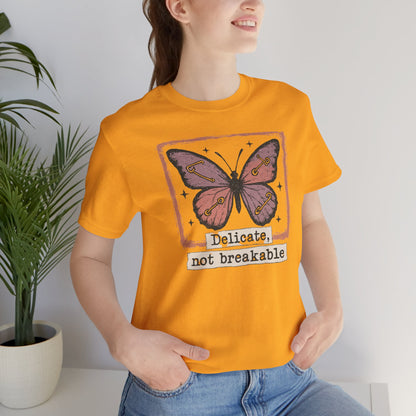 Delicate Not Breakable Butterfly Pocket Tee – Minimalist Affirmation T-Shirt, Self Love & Resilience Quote Shirt