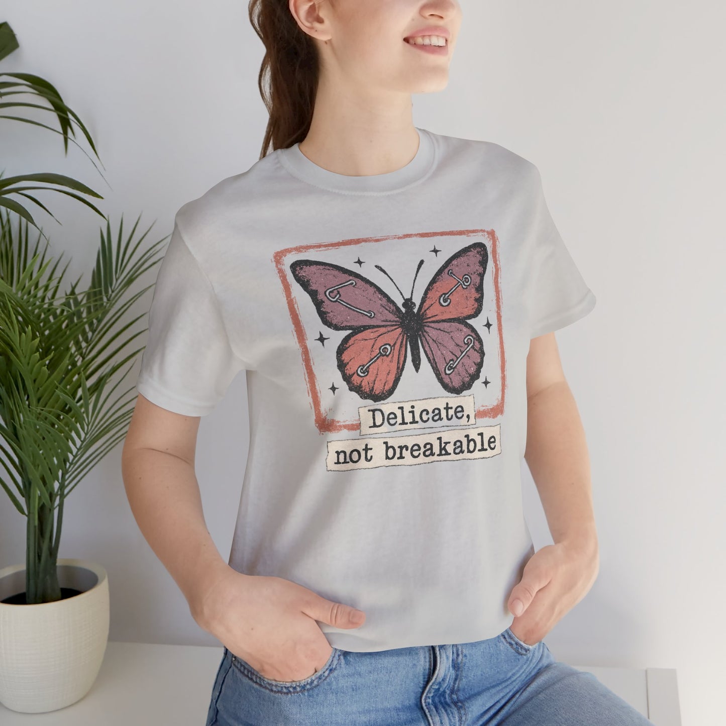 Delicate Not Breakable Butterfly Pocket Tee – Minimalist Affirmation T-Shirt, Self Love & Resilience Quote Shirt