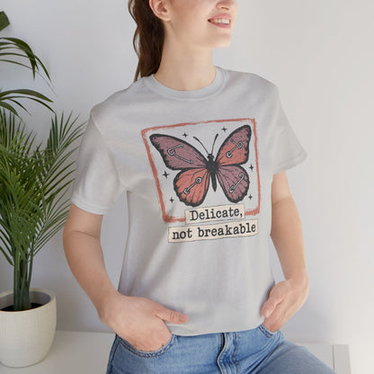 Delicate Not Breakable Butterfly Pocket Tee – Minimalist Affirmation T-Shirt, Self Love & Resilience Quote Shirt