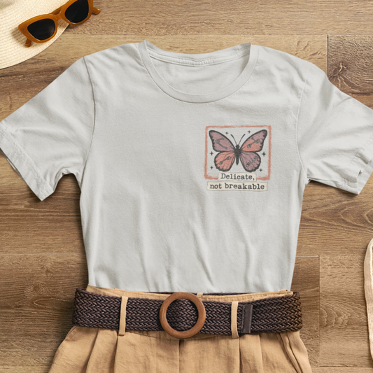 Delicate Not Breakable Butterfly Pocket Tee – Minimalist Affirmation T-Shirt, Self Love & Resilience Quote Shirt