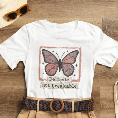 Delicate Not Breakable Butterfly Pocket Tee – Minimalist Affirmation T-Shirt, Self Love & Resilience Quote Shirt