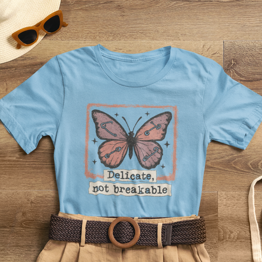 Delicate Not Breakable Butterfly Pocket Tee – Minimalist Affirmation T-Shirt, Self Love & Resilience Quote Shirt