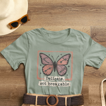 Delicate Not Breakable Butterfly Pocket Tee – Minimalist Affirmation T-Shirt, Self Love & Resilience Quote Shirt