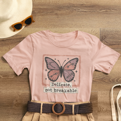 Delicate Not Breakable Butterfly Pocket Tee – Minimalist Affirmation T-Shirt, Self Love & Resilience Quote Shirt