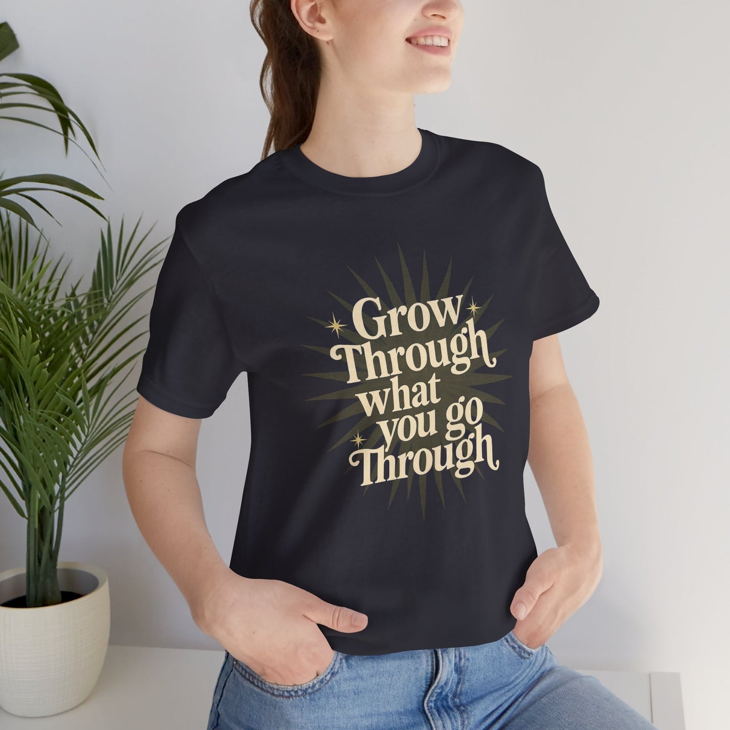 Sunburst motivational graphic T-shirt with "Grow Through What You Go Through" print, casual fit, designed by Printify.