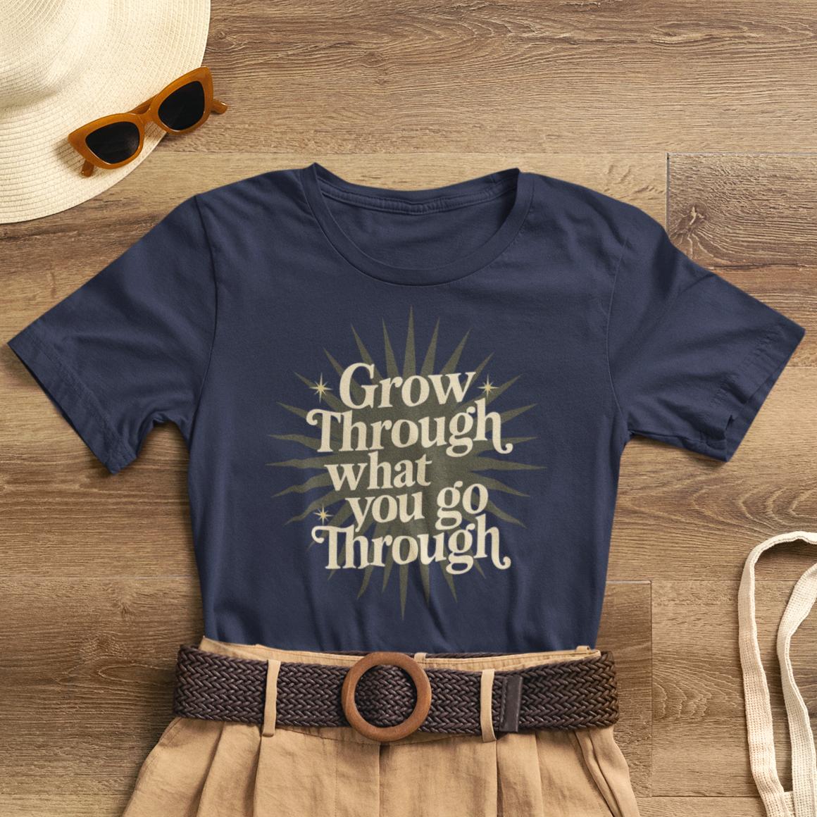 Yellow sunburst graphic T-shirt with inspirational "Grow Through What You Go Through" quote, casual motivational graphic tee.