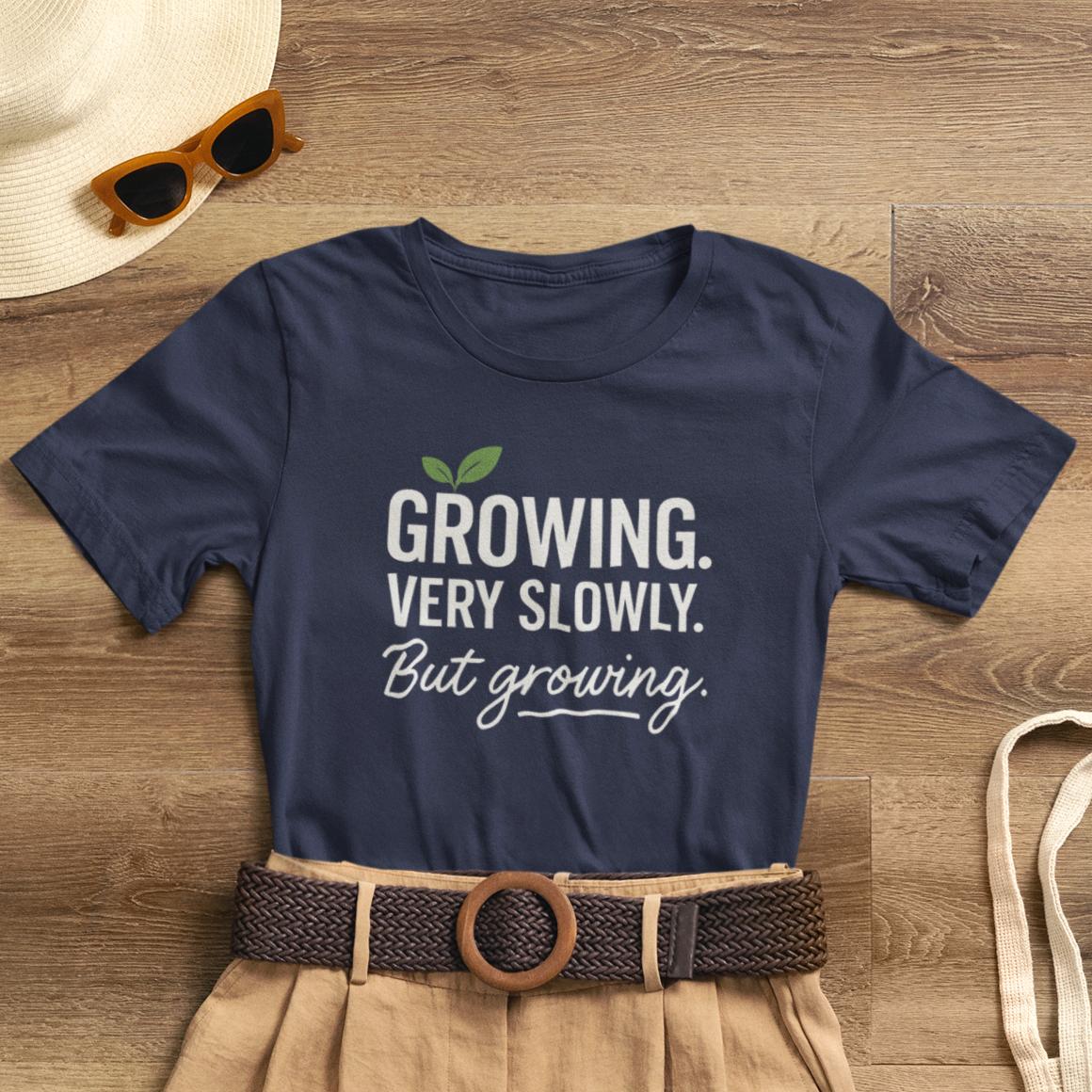 Gray Growing Very Slowly But Growing T-Shirt by Printify featuring a gentle growth and emotional healing design on soft cotton fabric.