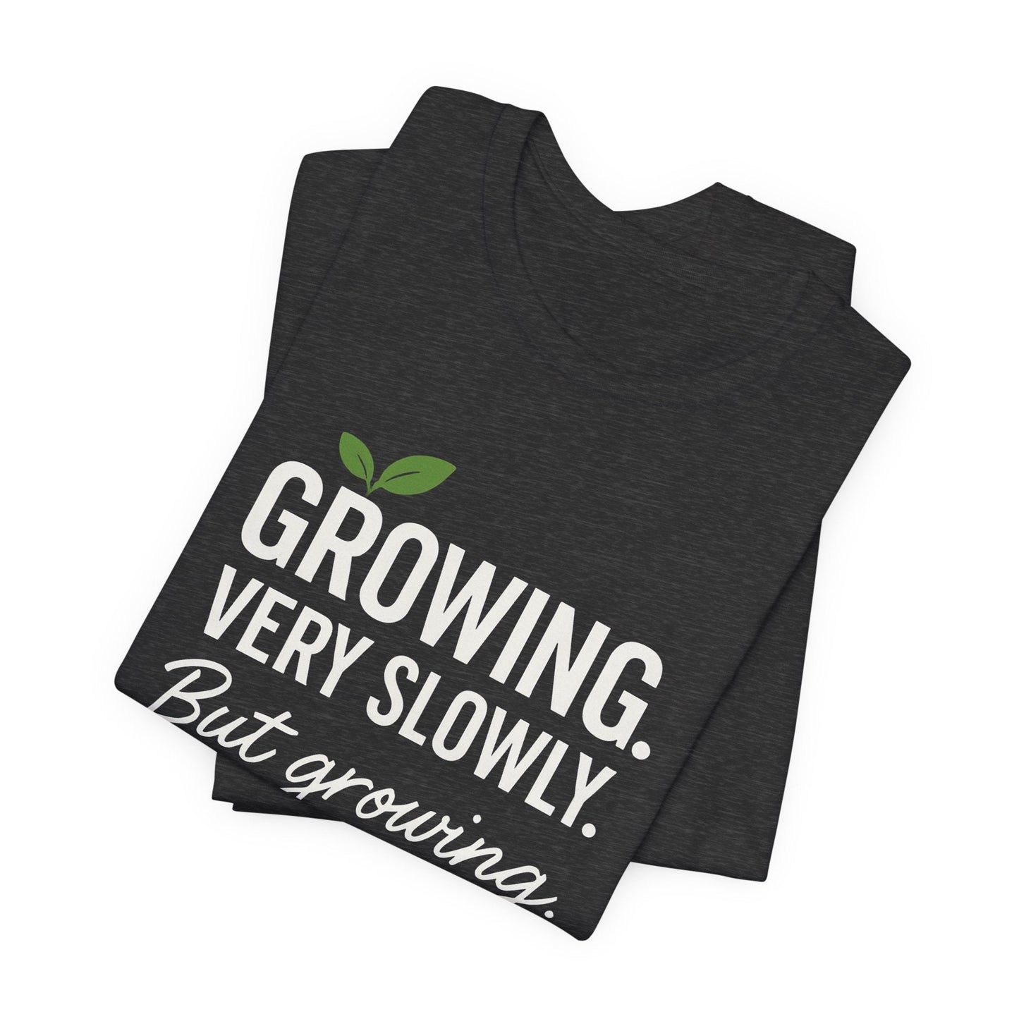 Light grey Growing Very Slowly But Growing T-Shirt by Printify featuring a gentle growth and emotional healing design on soft fabric.