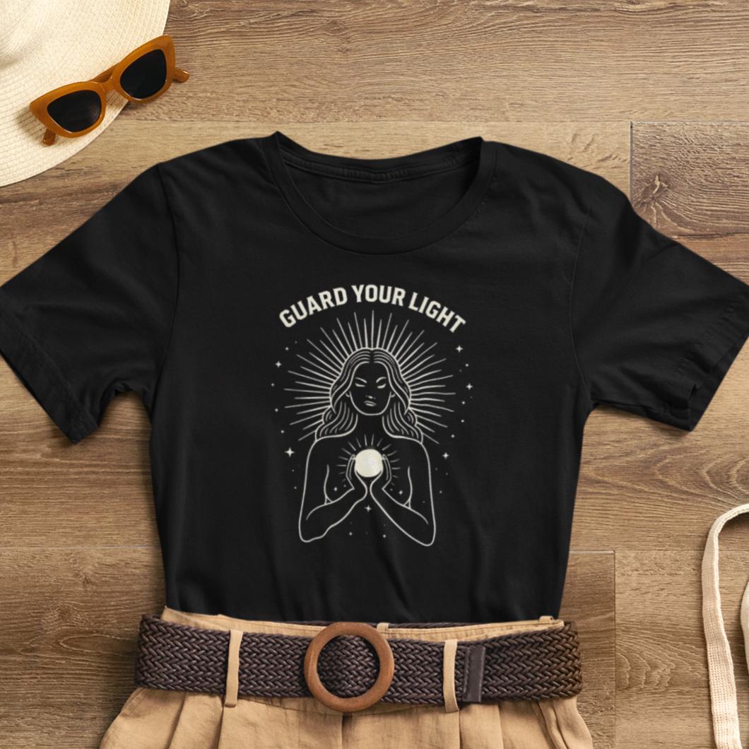 Sacred Feminine graphic tee featuring "Guard Your Light" design, perfect for women to express spiritual energy protection.