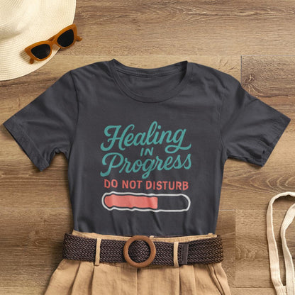 Soft emotional healing T-shirt by Printify featuring "Healing in Progress" typography and a "Do Not Disturb" design.