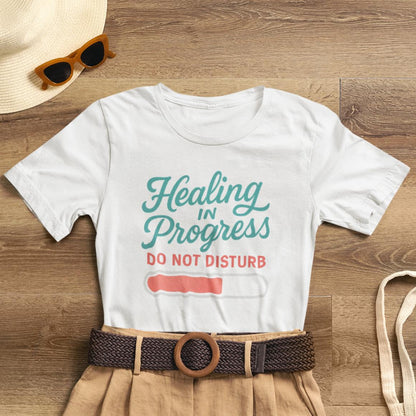 Soft emotional healing T-shirt by Printify featuring "Healing in Progress" typography and a "Do Not Disturb" message.