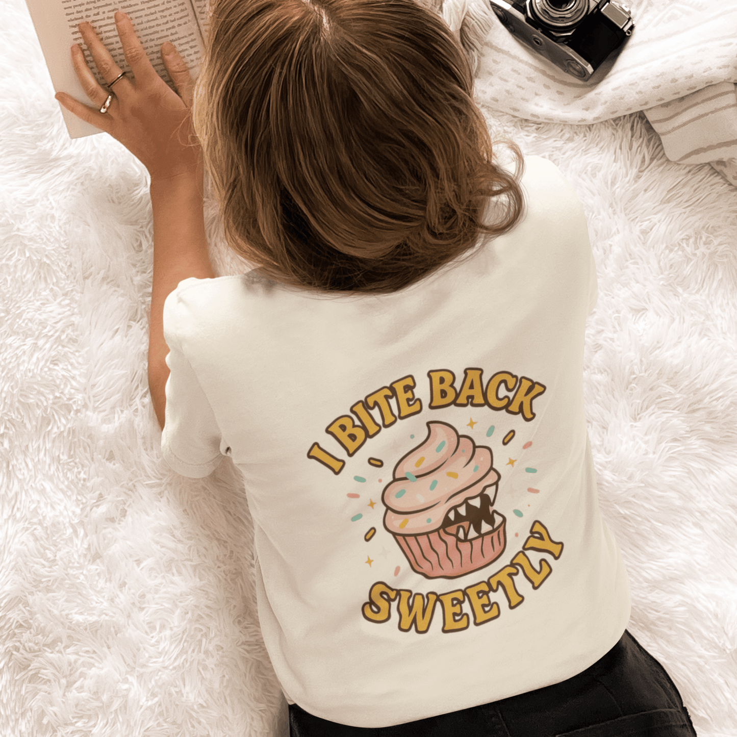 Printify I Bite Back Sweetly T-shirt featuring front and back cupcake graphics with a sassy quote, casual graphic tee for women.