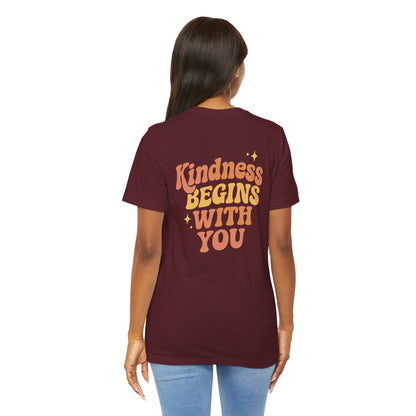 Printify kindness begins with you T-shirt featuring positive affirmation and mental health self-care graphic design on front and back.