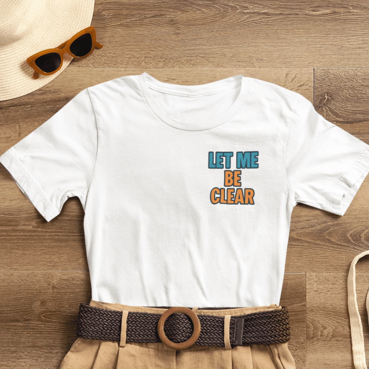 Let Me Be Clear T-Shirt by Printify featuring retro pop art feminist graphic with sparkles and bold text design.