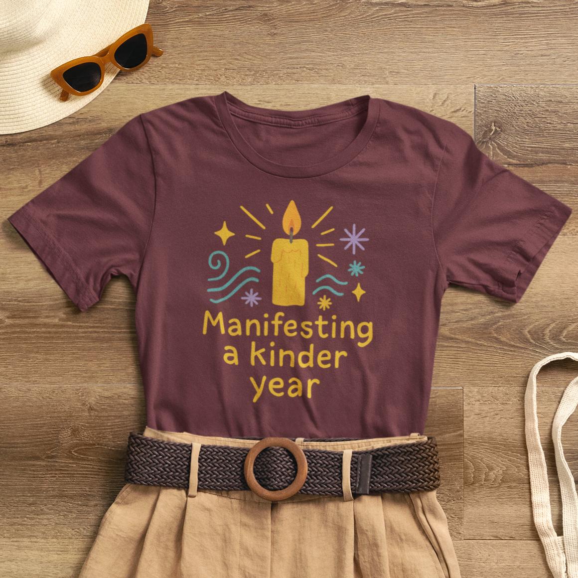 Soft spiritual graphic tee featuring "Manifesting a Kinder Year" design for mindful positivity, by Printify.
