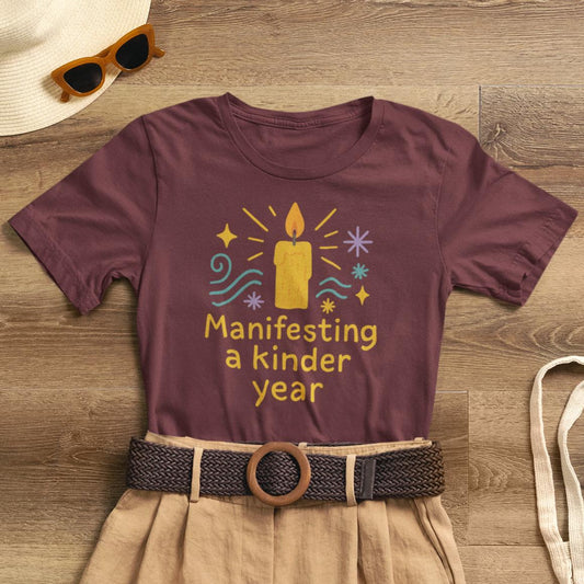 Soft spiritual graphic tee featuring "Manifesting a Kinder Year" design for mindful positivity, by Printify.