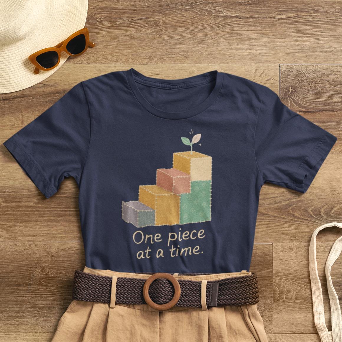 Printify One Piece at a Time T-Shirt featuring patchwork design and uplifting message for emotional healing and gentle progress.