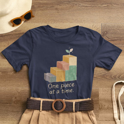 Printify One Piece at a Time T-Shirt featuring patchwork design and uplifting message for emotional healing and gentle progress.
