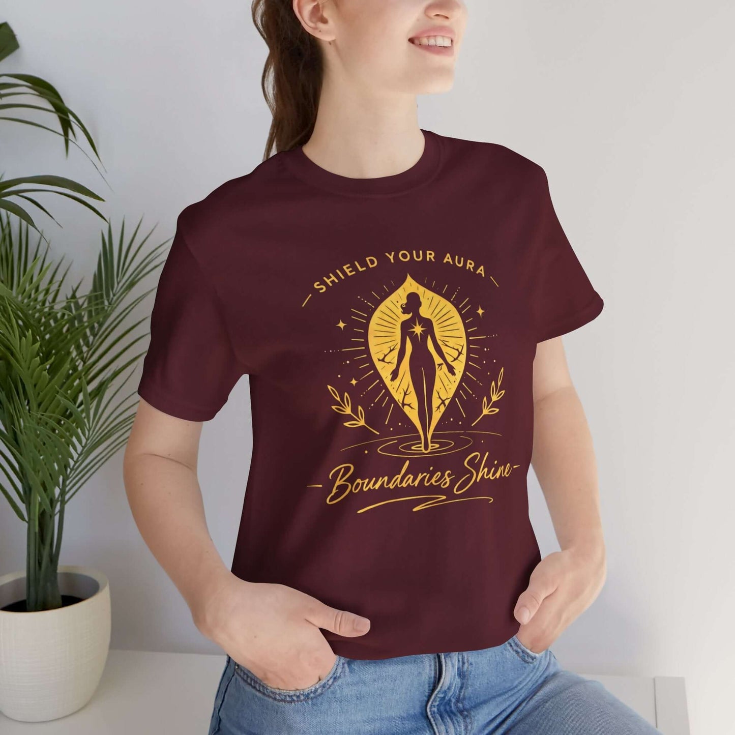 Shield Your Aura T-Shirt featuring a spiritual empowerment design, showcasing a comfortable black cotton tee with vibrant print.
