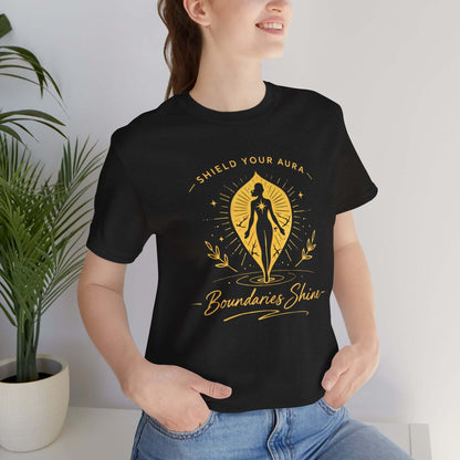 Shield Your Aura T-Shirt by Printify featuring a design that promotes boundaries and spiritual empowerment, with vibrant artwork.
