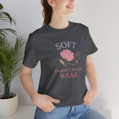 Feminist floral empowerment T-shirt by Printify featuring the "Soft Doesn’t Mean Weak" message on a soft, casual tee.
