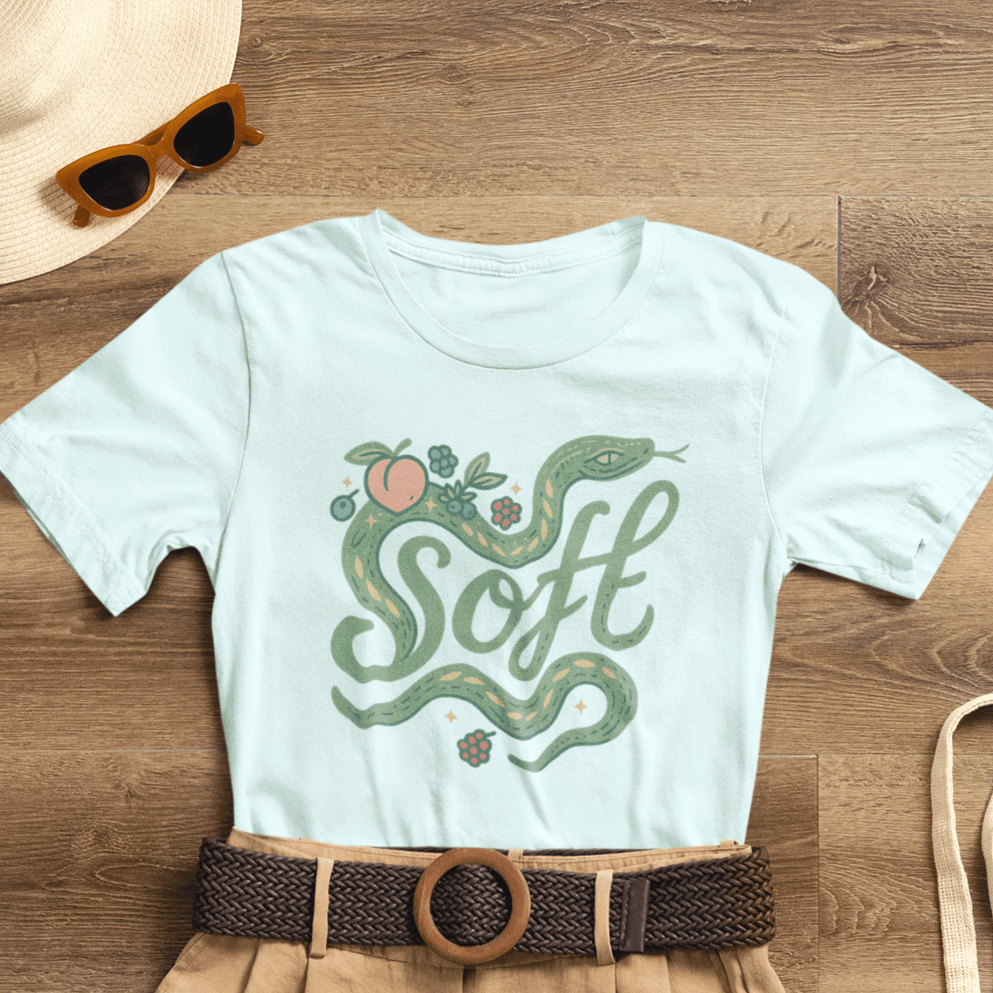 Unisex Soft Snake Graphic Tee featuring a botanical serpent design inspired by nature and whimsical eco aesthetics.