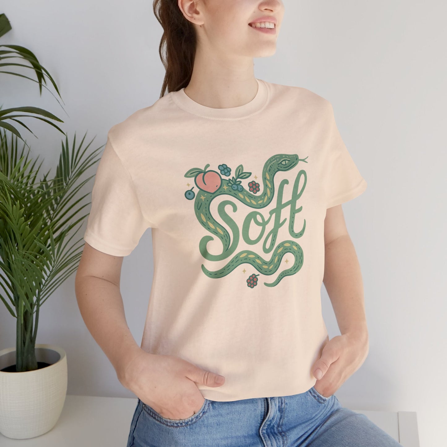 Unisex Soft Snake Graphic Tee featuring a whimsical botanical serpent design on a soft fabric background.