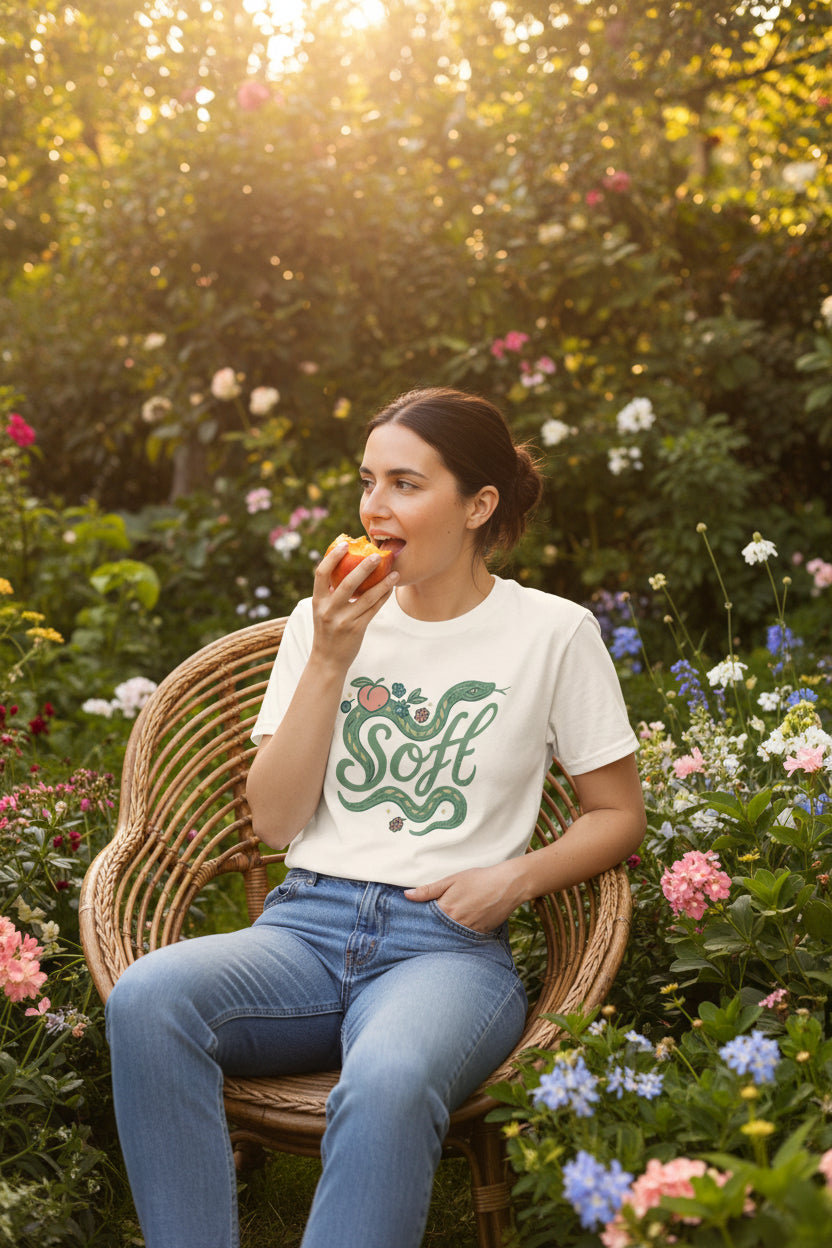 Unisex soft snake graphic tee featuring a botanical serpent design in a whimsical, nature-inspired style.