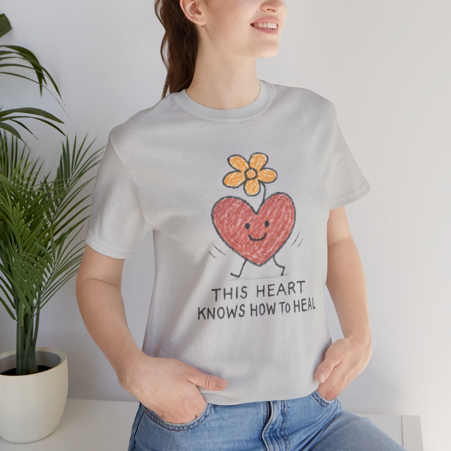 Printify Heart Knows How to Heal doodle T-shirt with a cute flower and heart design, perfect for a healing-themed casual look.