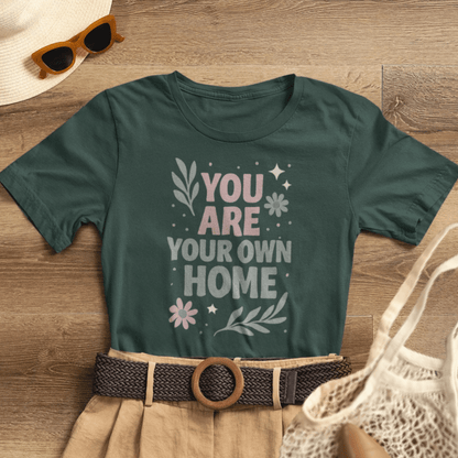 Gray You Are Your Own Home T-Shirt by Printify featuring a gentle reminder message for self-love and healing.