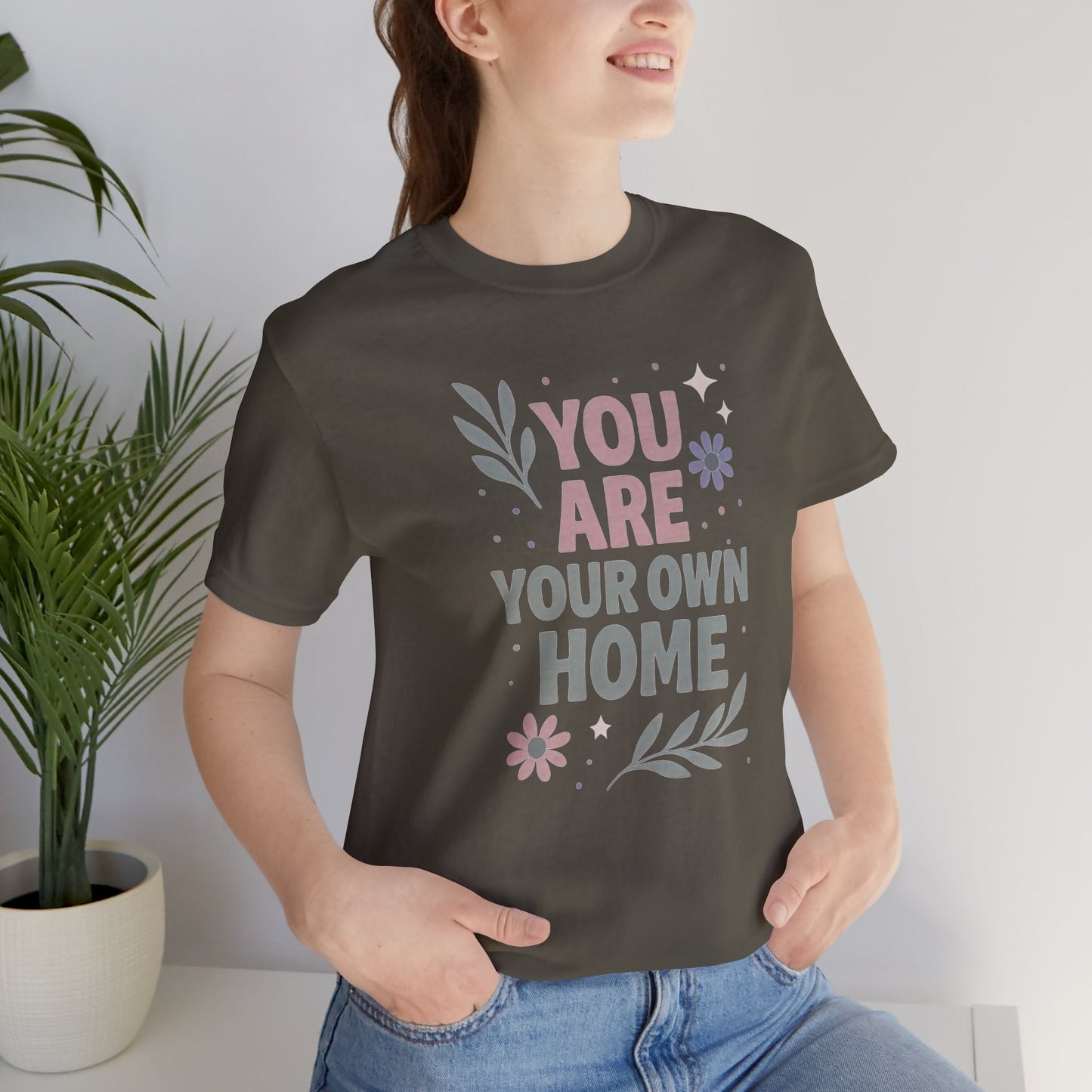 Gray "You Are Your Own Home" T-Shirt by Printify featuring a self-love and healing message on soft fabric.